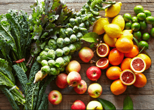 a group of fruits and vegetables on a wood surface Healthy Weight Loss Diets Bicester